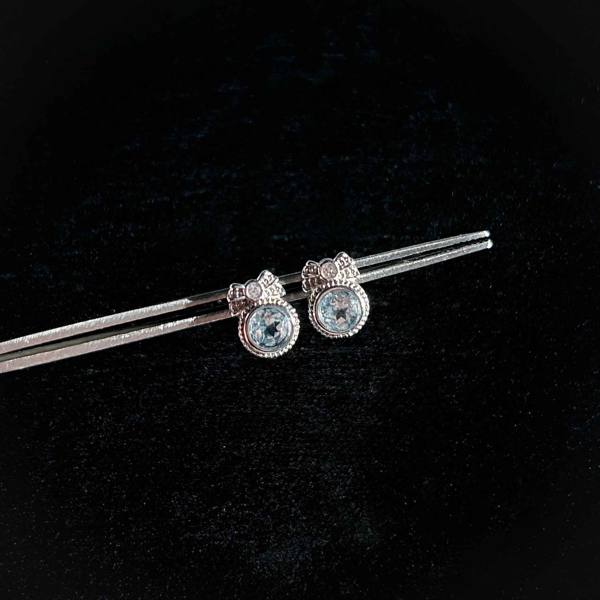 Blue Topaz with Ribbon Silver Stud Earrings