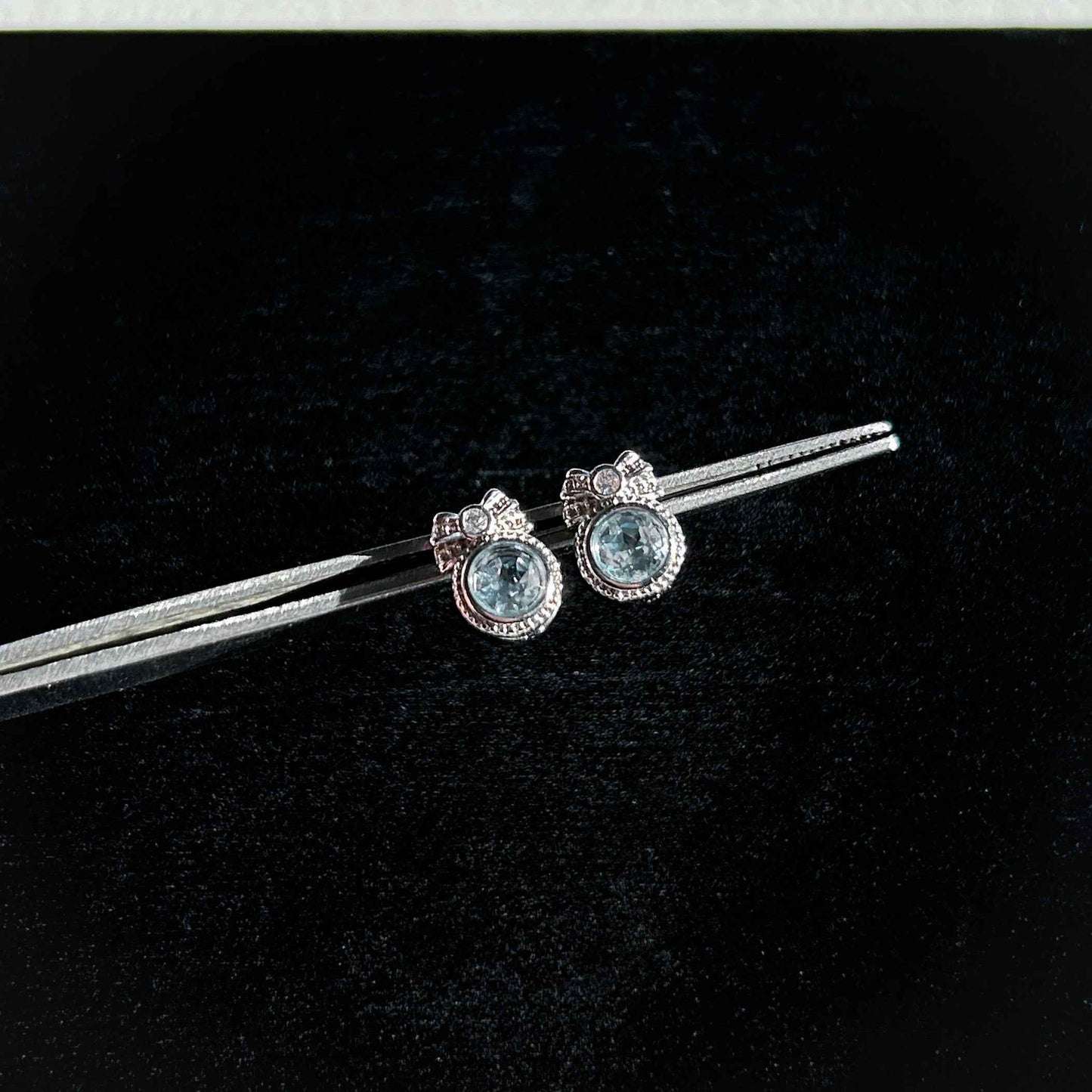 Blue Topaz with Ribbon Silver Stud Earrings