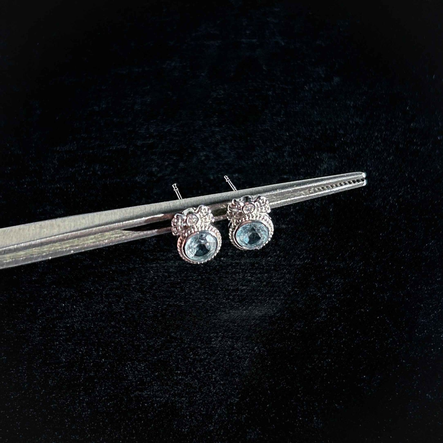 Blue Topaz with Ribbon Silver Stud Earrings